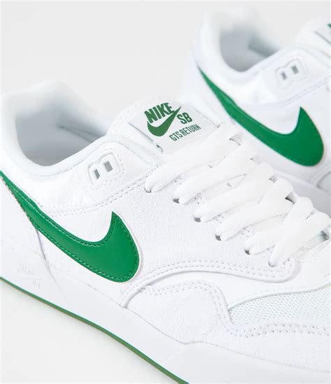 nike green and white trainers.